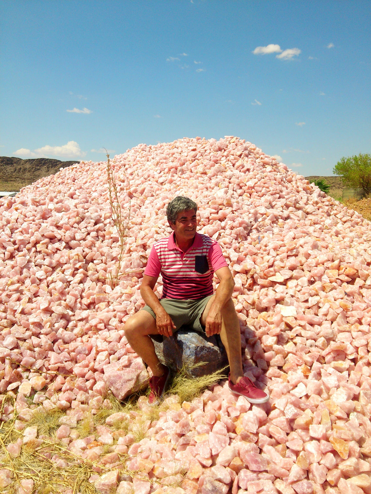 Connie on a heap of Rose Quartz