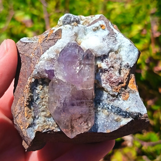 Amethyst With calcite In a Vug Within Basalt Matrix - 111g
